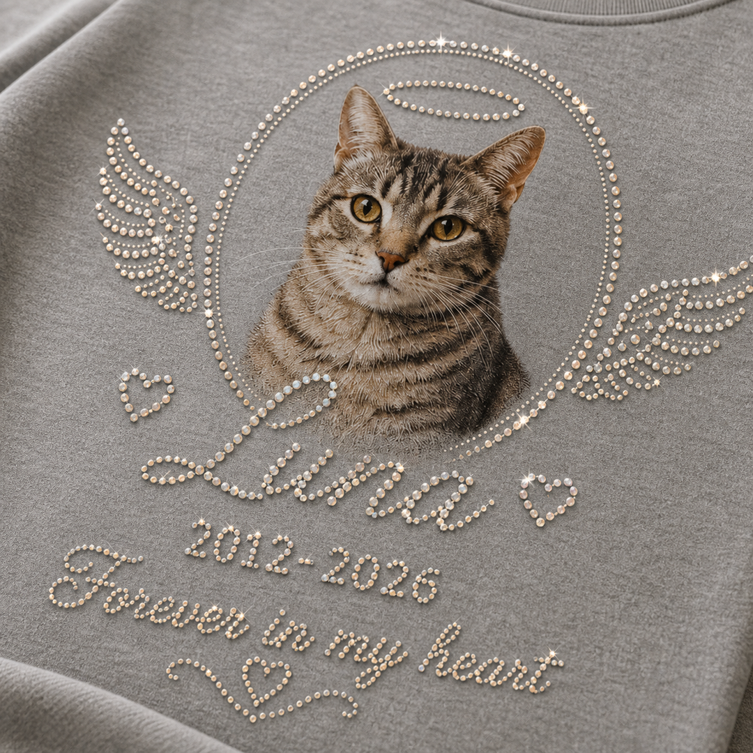 Close detail of custom pet memorial tee with rhinestone-style halo wings and cat photo